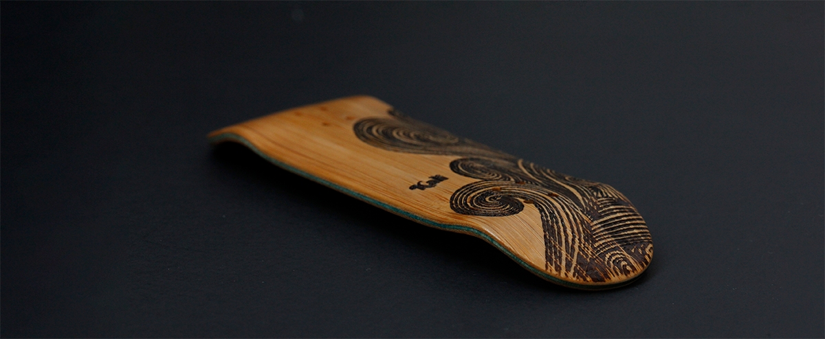 Kali Fingerboards deck, engraved bamboo bottom ply and turquoise middle plies